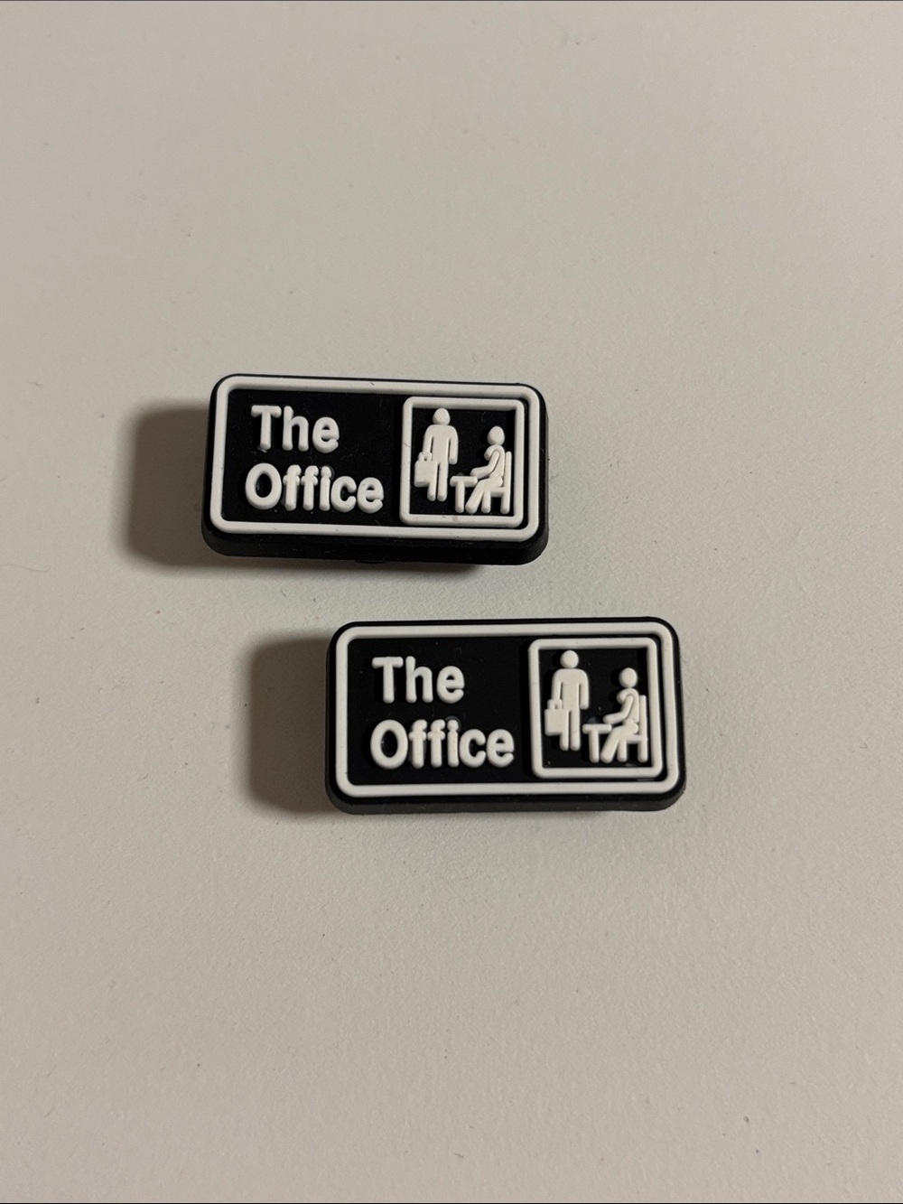 Two “the office” theme clog charms